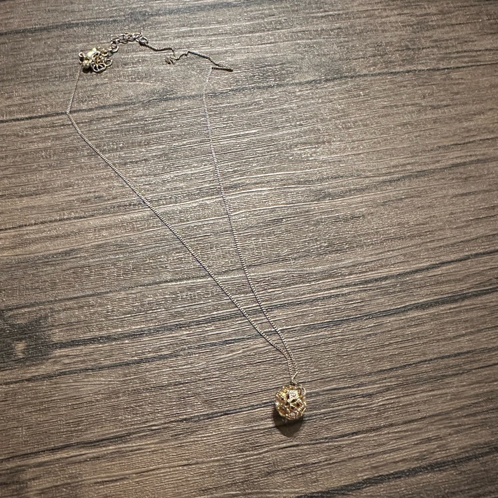 Gold sphere pendant necklace